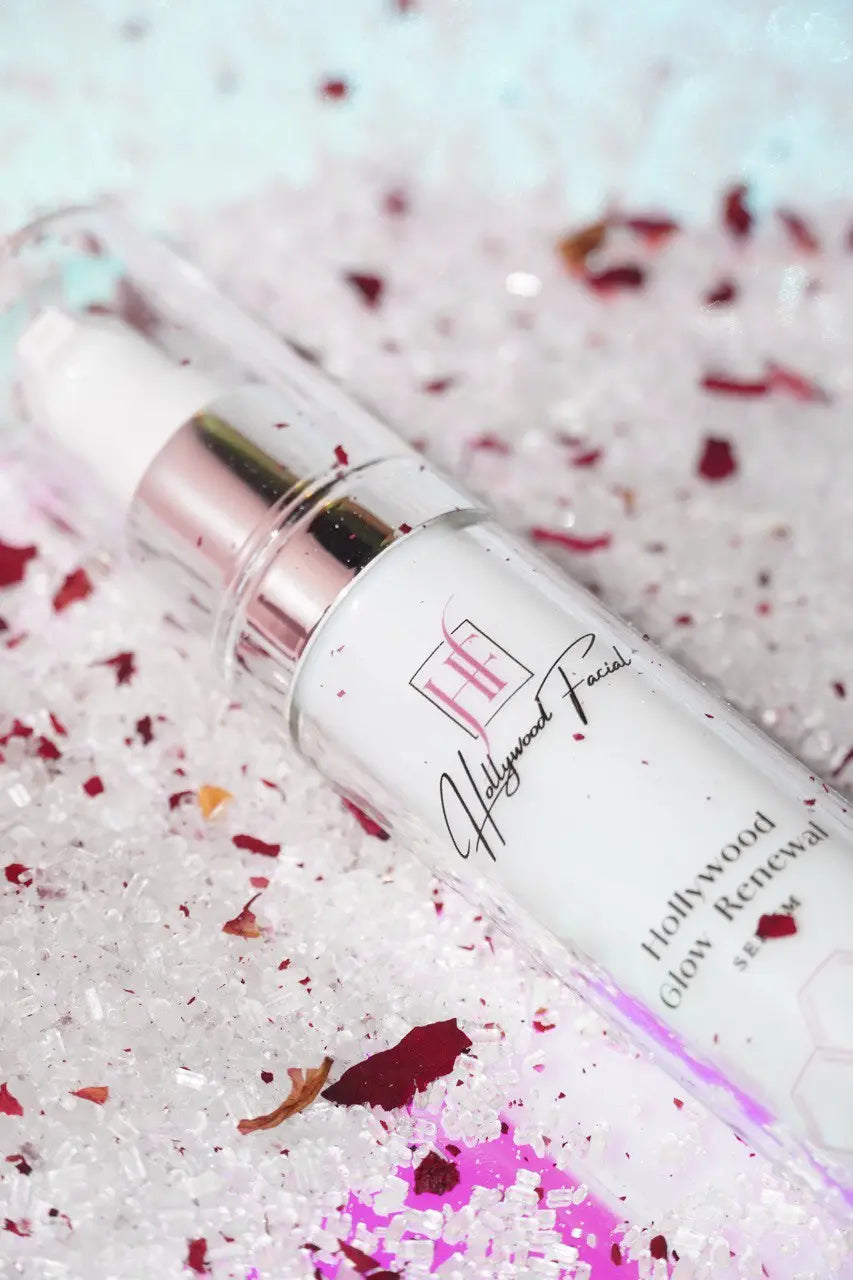 Skincare bottle labeled 'Hollywood Facial' on a textured background with pink and red elements